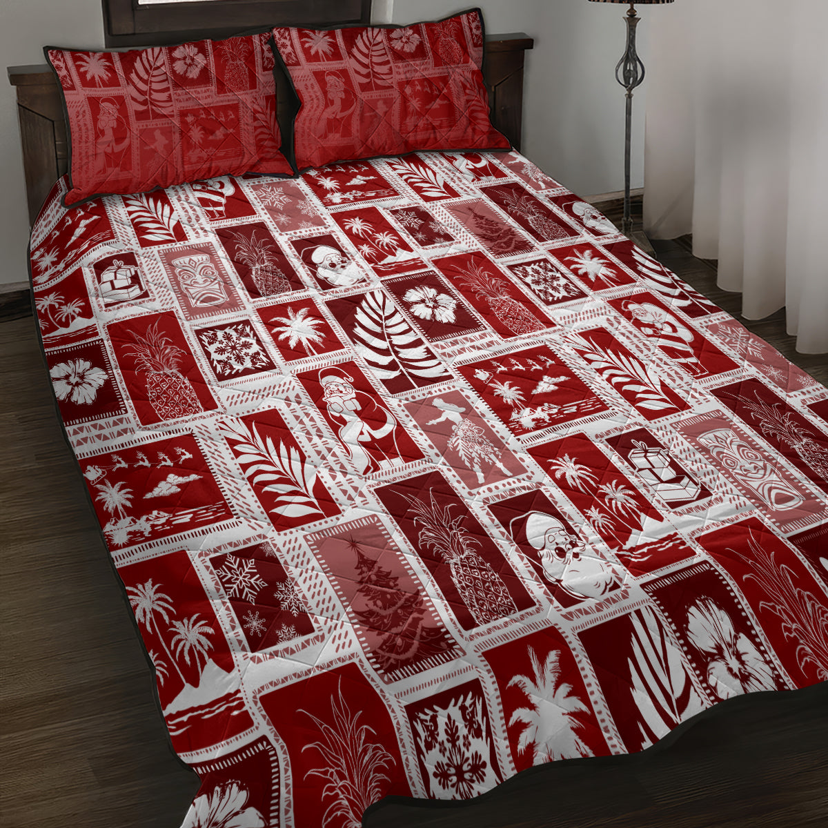 Red patchwork quilt and two pillows with white grid squares and tropical Christmas icons