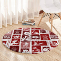 Red round patchwork Christmas rug with white square prints and gift, bird, and snowflake icons