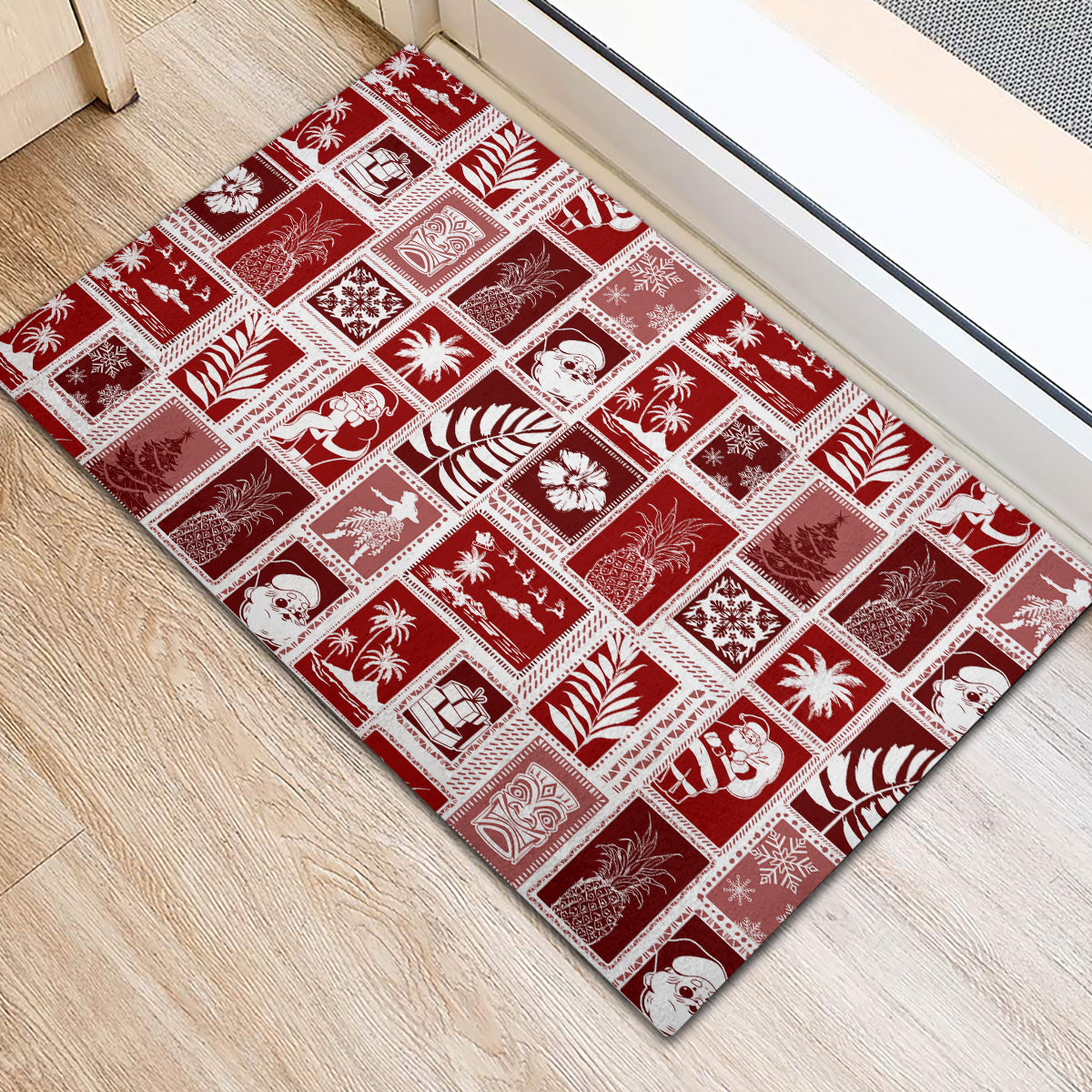 Red rubber doormat with white grid patchwork of holiday icons, flat rectangular