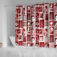 Red holiday shower curtain with patchwork squares of Santa, presents, trees, and snowflakes