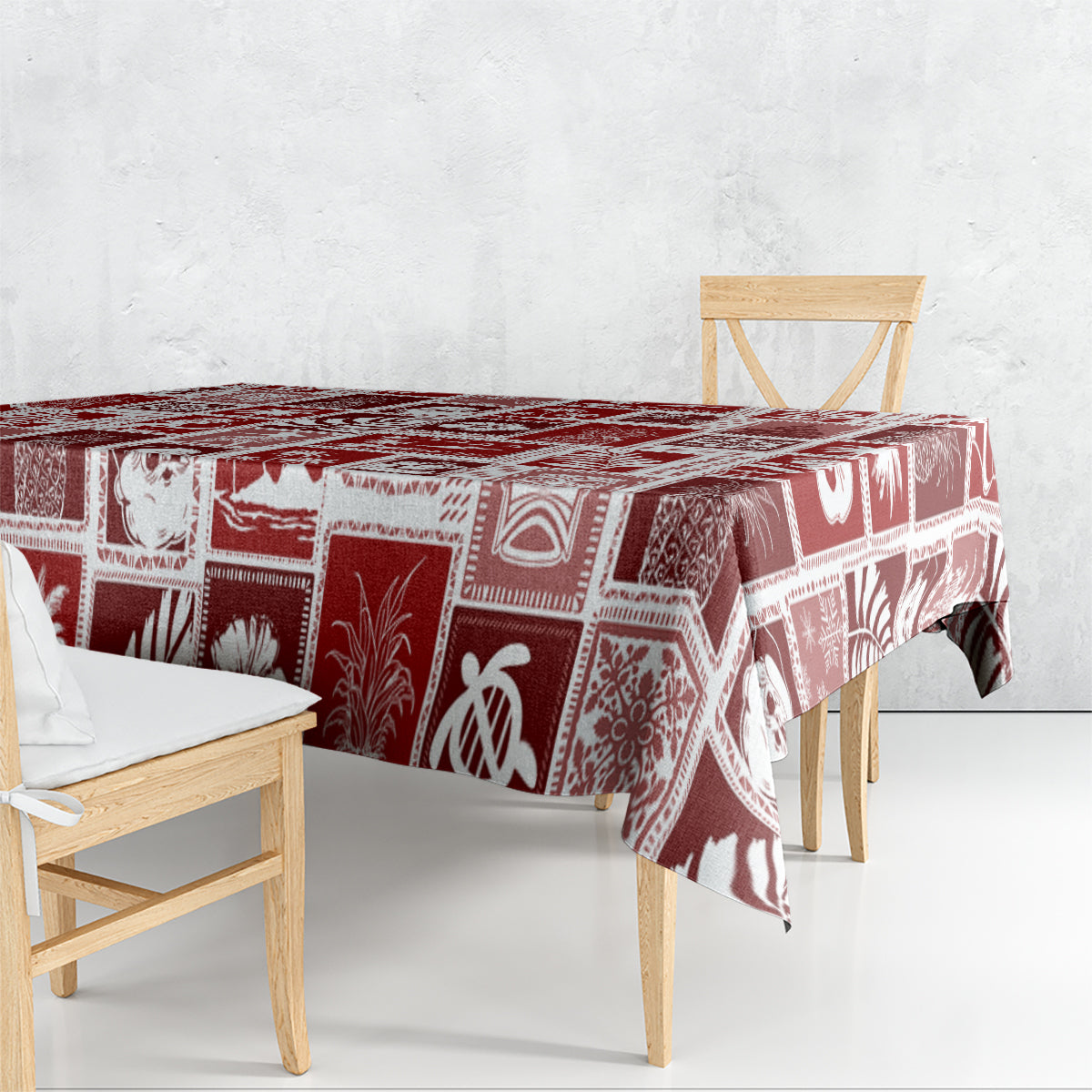 Red holiday patchwork tablecloth draped over rectangular dining table