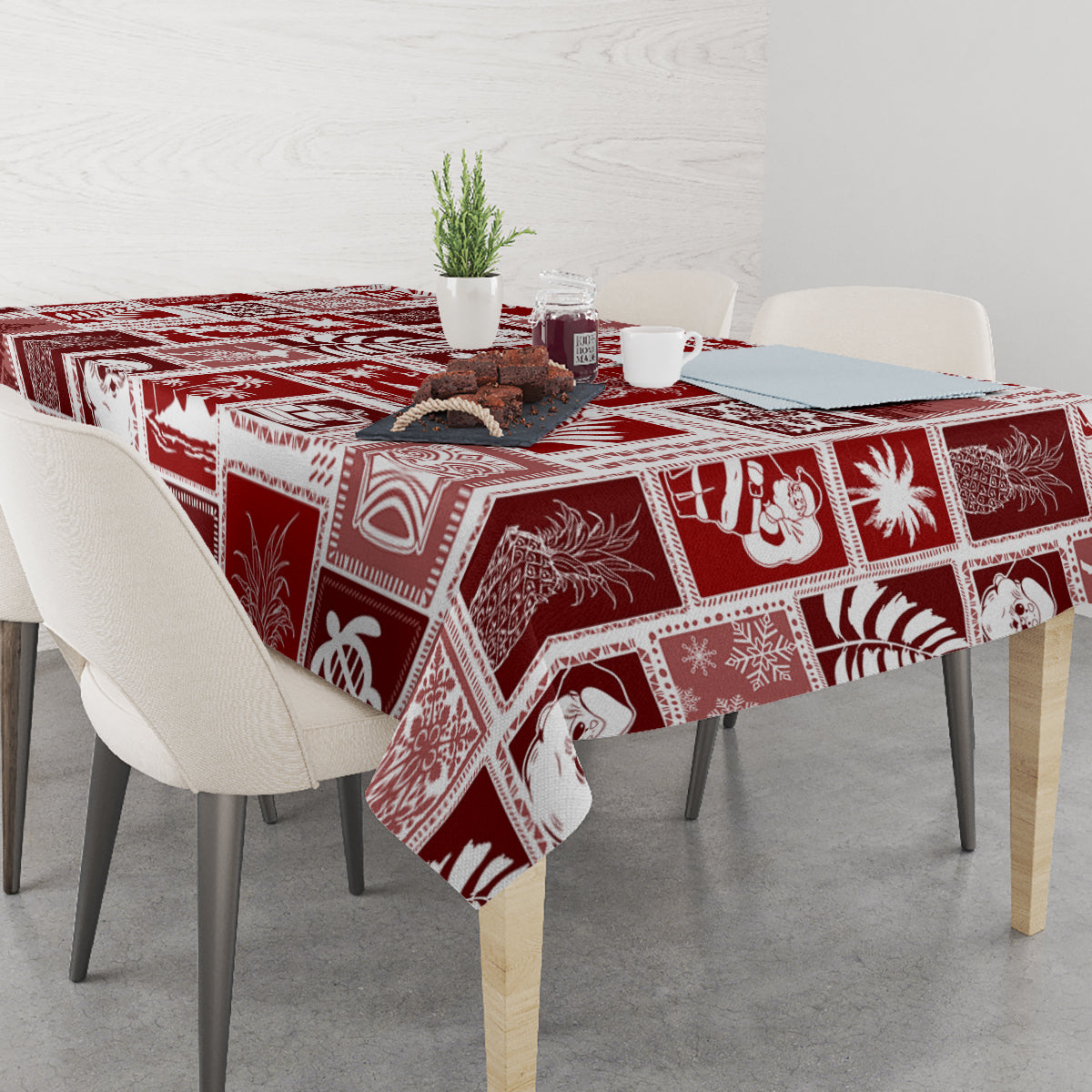 Red patchwork tablecloth with white festive motif panels on dining table