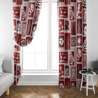 Red patchwork holiday curtain framing a window with hanging drape folds