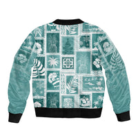 Teal patchwork bomber jacket with black ribbed cuffs, hem, and collar