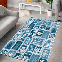 Aquamarine blue patchwork area rug with tropical and geometric tile motifs
