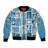 Aquamarine patchwork bomber jacket with zip front and black ribbed trim, novelty print