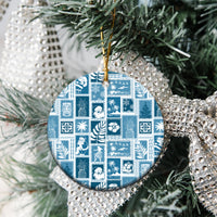 Aquamarine ceramic patchwork Christmas ornament, round design hanging from evergreen