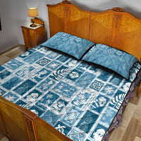Aquamarine quilt bed set with matching pillow shams, blue patchwork and border trim