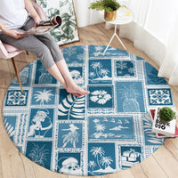 Round aquamarine patchwork rug with blue island icons and gift motifs, laid flat