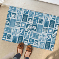 Aquamarine rubber doormat with patchwork tropical and winter-themed motifs underfoot