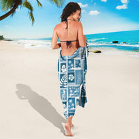 Aquamarine blue sarong with white tropical patchwork print and back tie