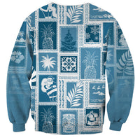 Aquamarine crewneck sweatshirt with assorted patchwork island icons and gift motifs, long sleeves