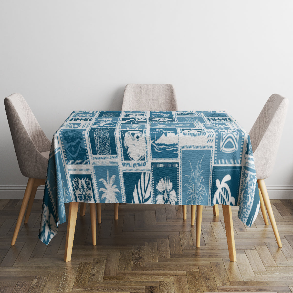 Aquamarine blue patchwork tablecloth with square blocks and tropical leaf designs