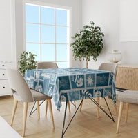 Aquamarine blue patchwork tablecloth on rectangular table, tropical holiday motif pattern