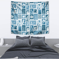 Aquamarine patchwork tapestry featuring white retro figures, palm leaves, and island motifs