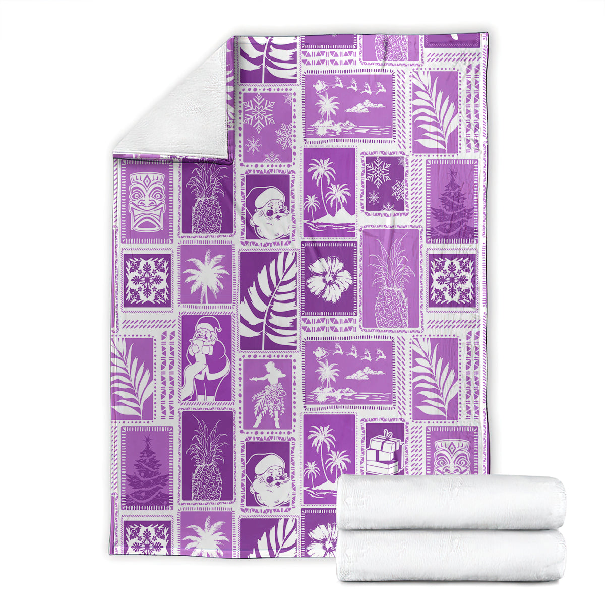 Violet patchwork Christmas blanket folded with matching white towels beside it