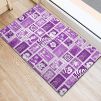 Violet rubber doormat featuring white patchwork icons and borders