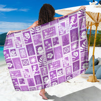 Purple patchwork sarong with white tropical print, draped and held open
