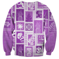 Violet crewneck sweatshirt with white patchwork holiday graphics, long sleeves