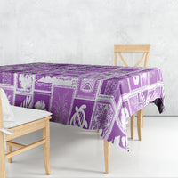 Violet printed tablecloth with patchwork square patterns and tropical designs.