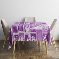 Violet patchwork tablecloth with leaf and island-themed icons across the top.