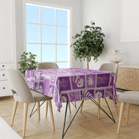 Violet patterned tablecloth with patchwork squares and tropical motif blocks.