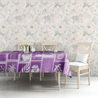 Violet printed tablecloth featuring tropical patchwork squares and decorative icons.