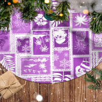 Violet patchwork tree skirt with white fringed trim and winter motif squares