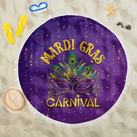 Purple round beach blanket with fringe, Mardi Gras Carnival graphic and mask design.