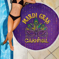 Purple round beach blanket with fringe, Mardi Gras Carnival mask design, poolside.