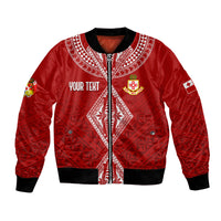 Red bomber jacket with black ribbed trim, front zip, white patterned yoke and crest, patch sleeves