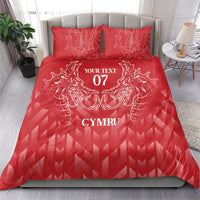Red duvet cover set with dragon emblem, “YOUR TEXT 07” and “CYMRU” on bed