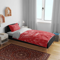 Red bedding set on bed with white dragon crest, “YOUR TEXT 07” and “CYMRU”