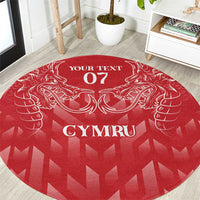 Red round rug with white heraldic dragon, 'YOUR TEXT 07', and 'CYMRU' print
