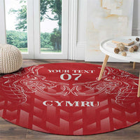 Red round rug with white dragon crest, 'YOUR TEXT 07' header, and 'CYMRU' center text