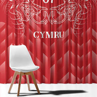 Close view of red curtain fabric with white dragon artwork and “CYMRU” text, floor-length.