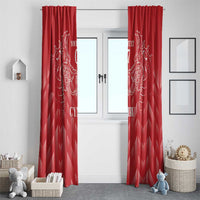 Red curtain panels with white dragon emblem and zigzag pattern, set across a double doorway.