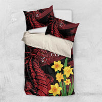 Black duvet and pillow bedding set with red dragon, yellow daffodils, and 'CYMRU' text.