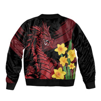 Black bomber jacket with ribbed collar; dragon graphic and yellow daffodils on back