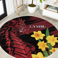 Round black rug with red dragon artwork, yellow daffodils, and “CYMRU” center text
