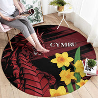 Round black rug with red dragon and yellow daffodils, “CYMRU” logo near center
