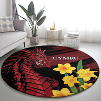 Round black rug with red dragon illustration and yellow daffodils, “CYMRU” text