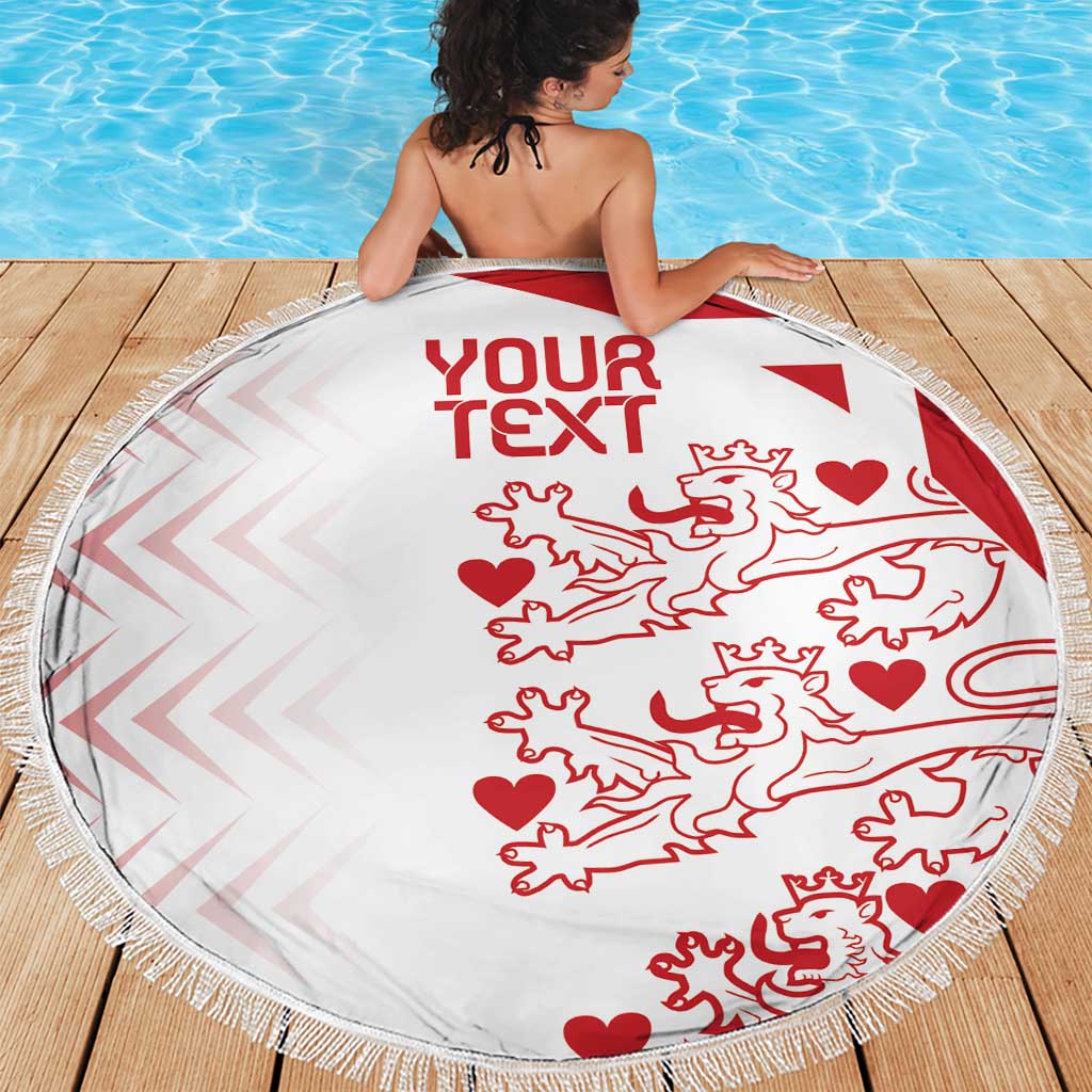 White round beach blanket with red custom text and lion pattern, tassel-fringed edge