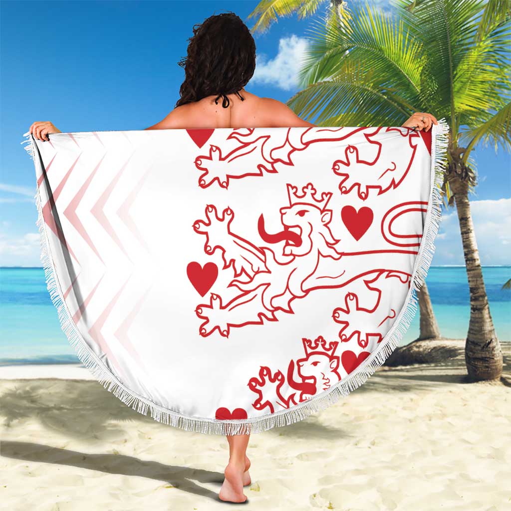 White round beach blanket with red lion and heart motif, custom text, fringed border
