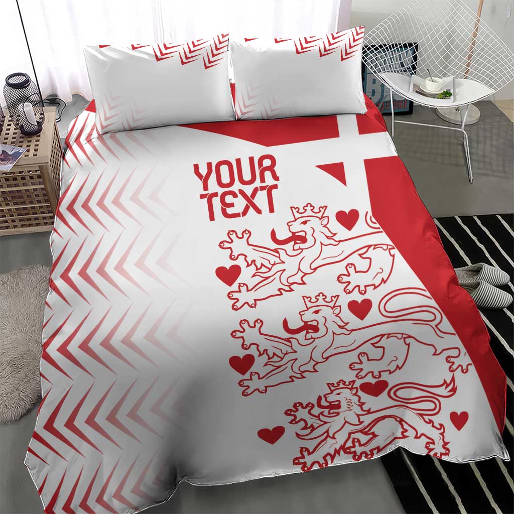 White and red duvet cover with pillow shams showing chevron border and lion hearts artwork