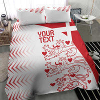 White and red duvet cover with pillow shams showing chevron border and lion hearts artwork