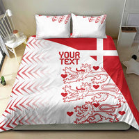 White and red duvet cover on bed with two pillow shams; chevrons, lions and hearts