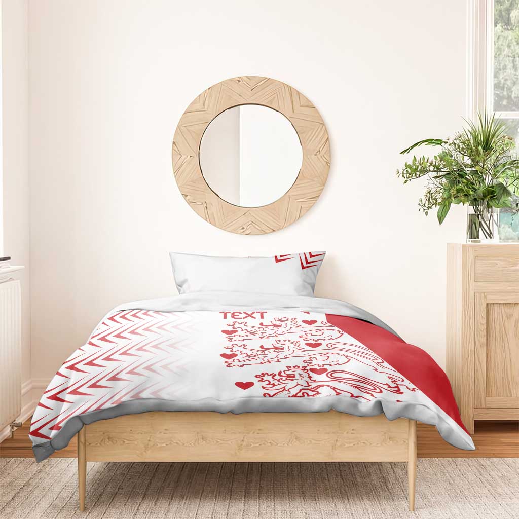 White and red duvet cover with matching pillow shams and lion hearts print