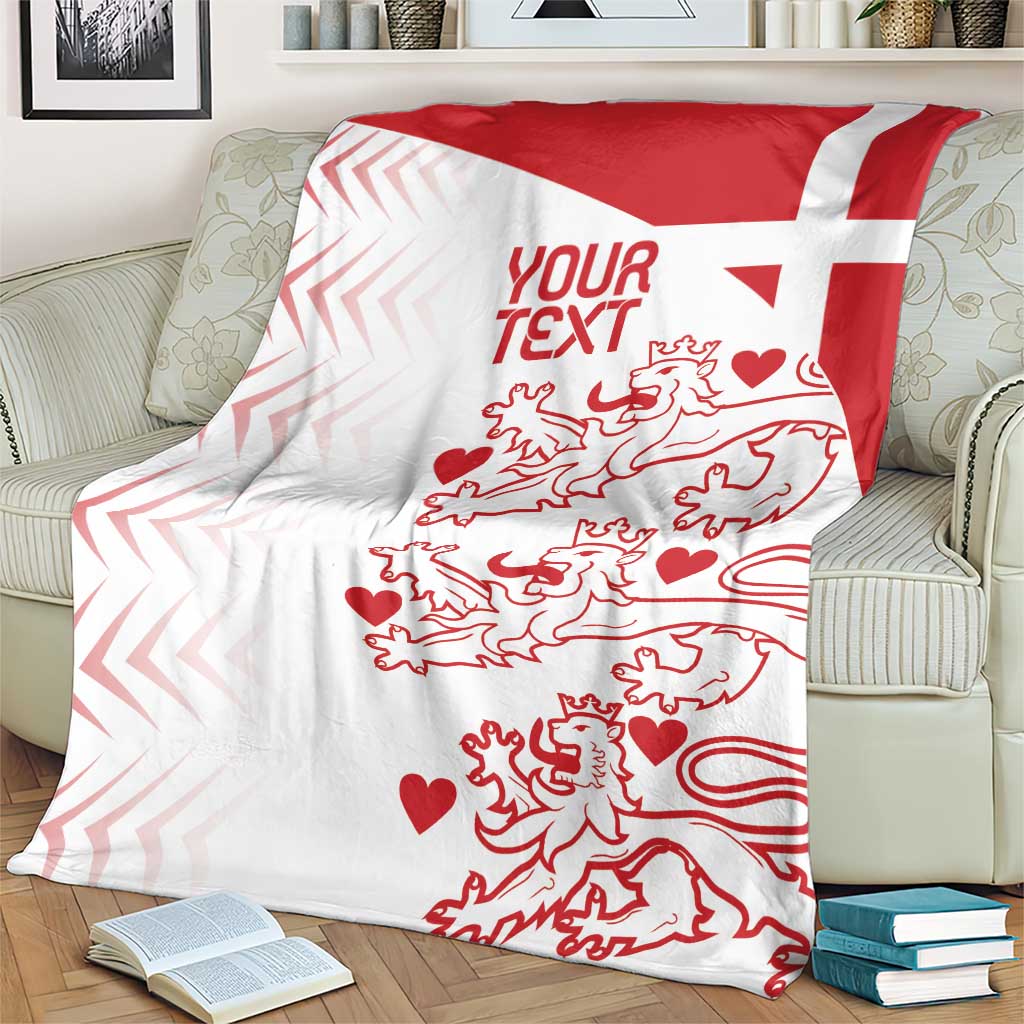 Red and white Denmark football blanket with lion silhouettes, hearts, and red text area