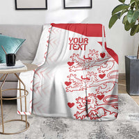 Red and white Denmark football blanket draped on sofa, centered text area and lions